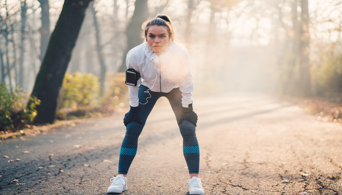 Woman taking a breath after a run | DNAfit Blog